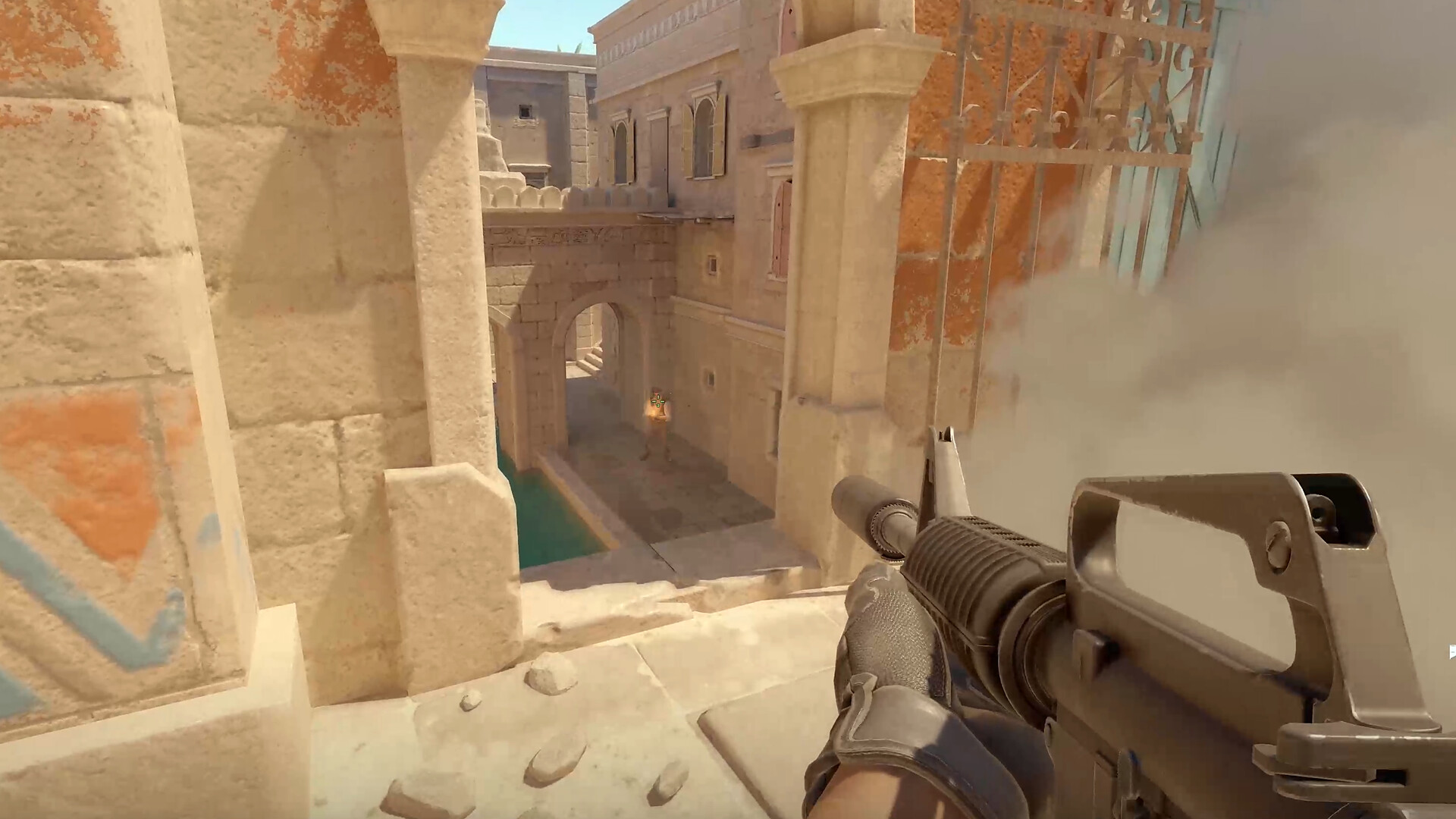 Official Counter-Strike 2 gameplay screenshot showing a first-person firefight through smoke